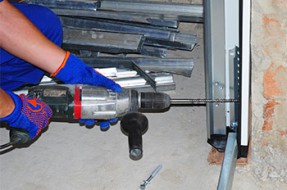 Man repairing a door